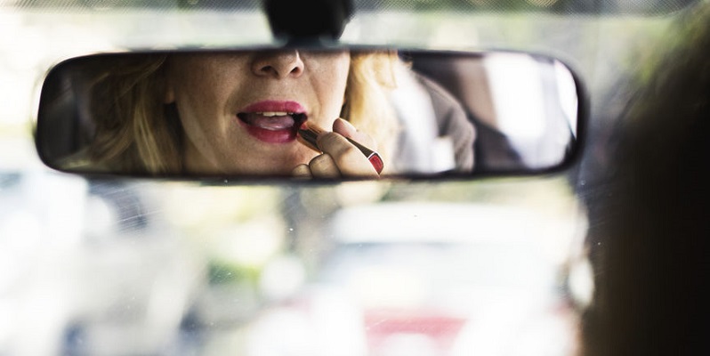 Woman Applying Makeup While Driving